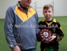 North Antrim Youth Development Officer Paddy Gray presenting St Olcans Team Captain Sean McAuley with the TeamKit U14 Division 3 Airborne Hurling League Shield